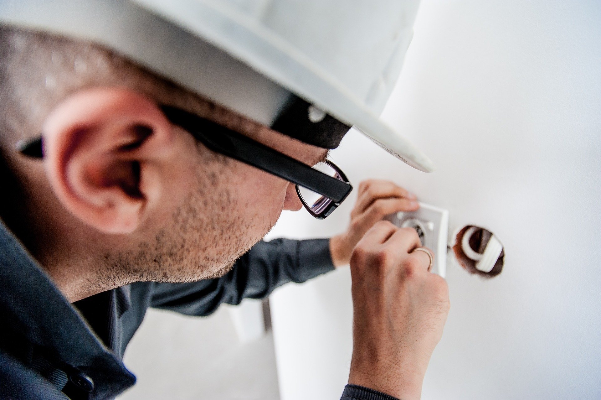 Electrician fixing an outlet