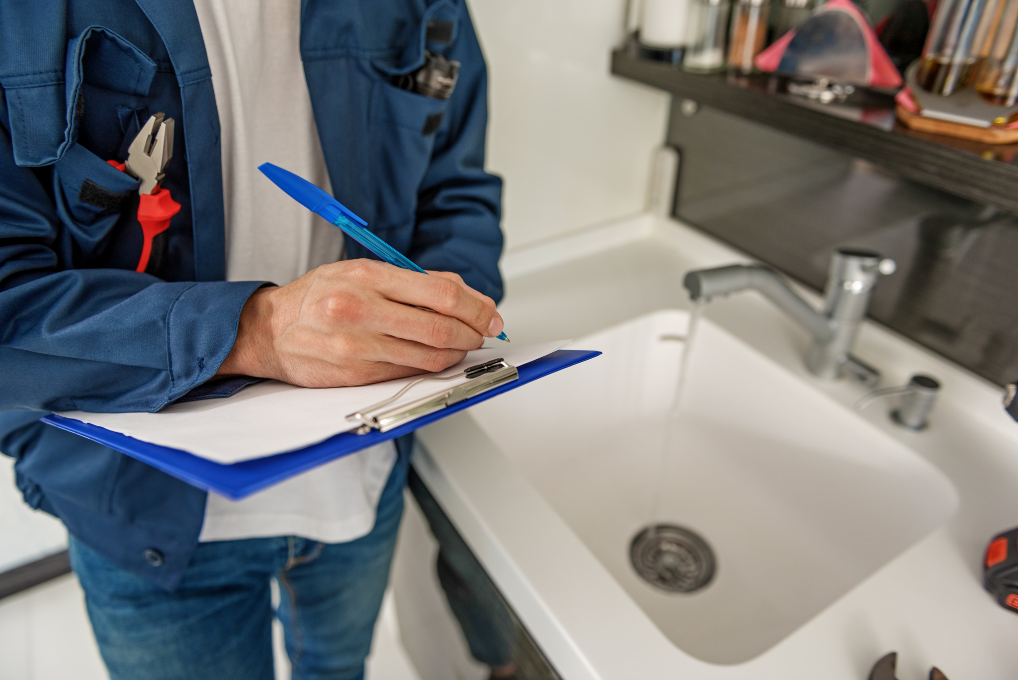 Inspector working next to a sink.